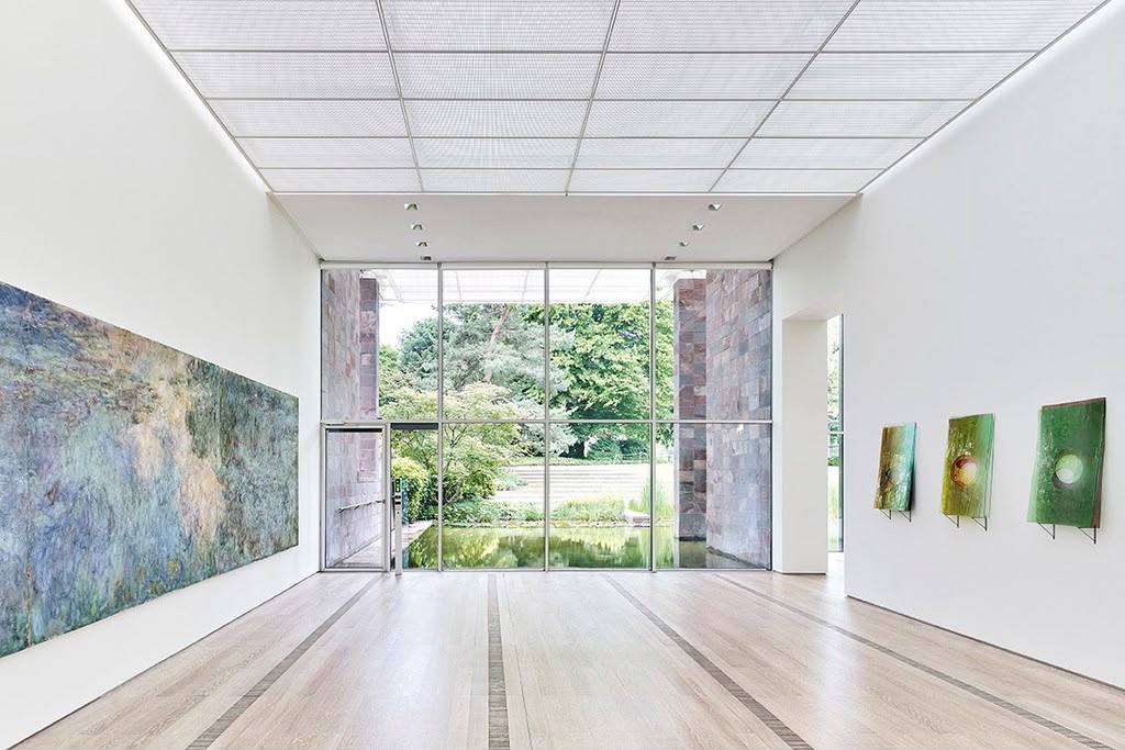 Bright contemporary art gallery looking out to a garden